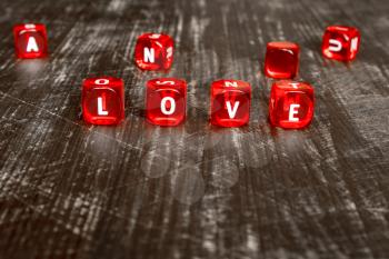 Group of red dice over wooden background with word written LOVE
