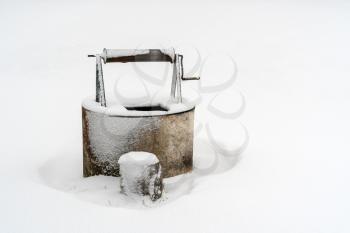 Old draw-well covered with snow