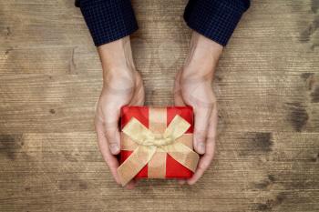 Man holding a Christmas, birthday or Valentine's day gift 