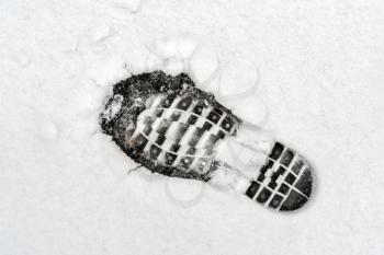 Human footprint on fresh white snow
