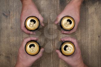 Top view group of friends holding beer cans