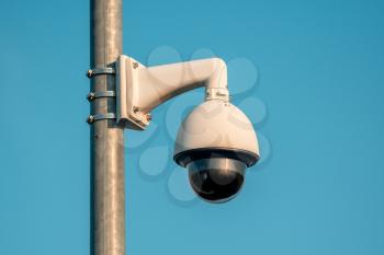 CCTV Security camera at public area.CCTV security outdoor camera on electric pole with blue sky background.