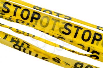 Barrier tape for no entry at an construction site or crime zone. STOP tapes isolated on white background.