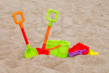 Vacation image of children's beach toys on the sand