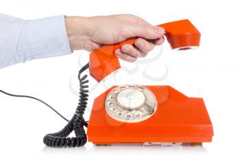 A hand picking up a phone, isolated white background