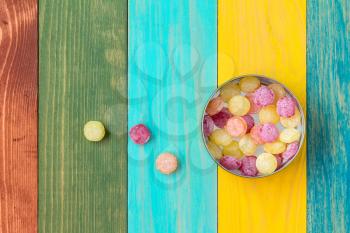 Multicolored candies in metal box, top view 