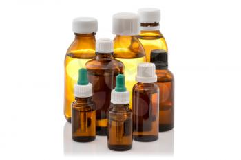 Group of glass bottles with medicine on white background