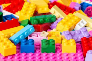 Colored plastic toy bricks background,close-up view