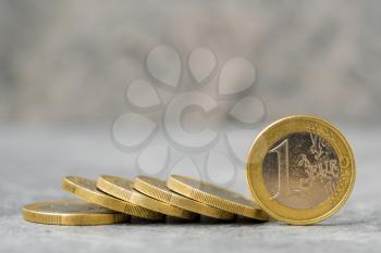 Coins of One Euro on the stone background
