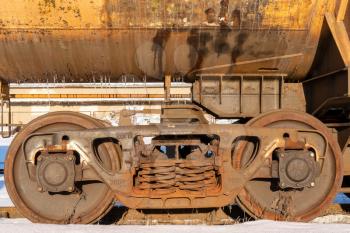 Wheels of a railway train on rails close up, cargo transportation