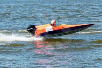 Powerboat in fast action race on the lake