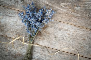Bunch of dry lavender flowers on the wooden background