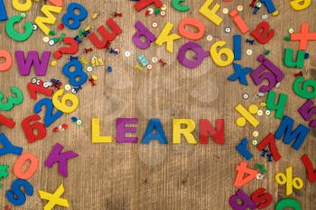 Plastic Alphabet Letters spelling the word LEARN