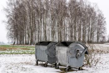 Garbage containers in the countryside during winter season
