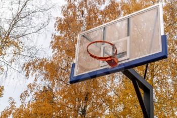 Close up shot of basketball hoop with broken net