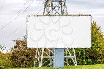 Blank billboard beside the high-voltage tower. Copy space.