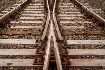 Two railway tracks merge together. Choosing right way, making decision concept. 