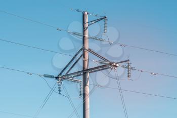 High voltage electric transmission pole. Distribution electric substation with power lines and transformers.
