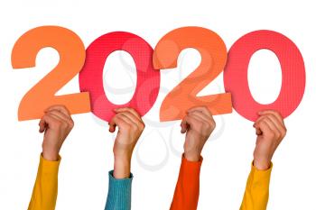 Hands with colorful numbers shows year 2020. New year concept.