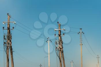 Electric transmission poles. Distribution electric substation with power lines and transformers.