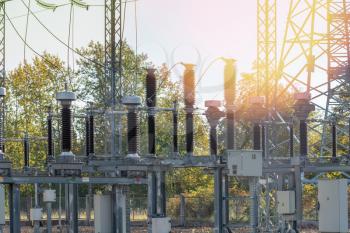 Power substation with electrical insulation and electrical equipment at sunny morning