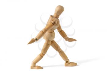 Wooden figure in walk action, isolated on white background