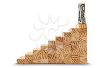 Dollar standing on top of a stairs of wooden cubes. Achieving goals, career growth, success.