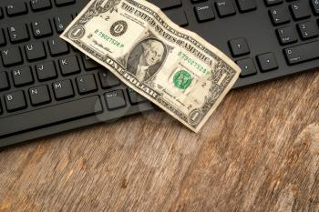 American dollar on computer keyboard. E-commerce, online shopping concept