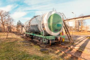 Single petroleum tank on the railroad. Train delivering oil or gas.