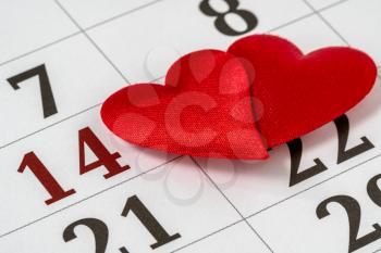 Valentine's day background, February 14 on the calendar with red hearts 