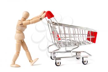 Wooden man pushing a shopping cart. Go shopping looking for deals
