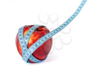 Diet concept with red apple and measure tape.Copy space