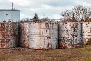Old oil tanks in abandoned cargo service terminal