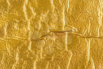 Shiny yellow leaf gold foil texture background