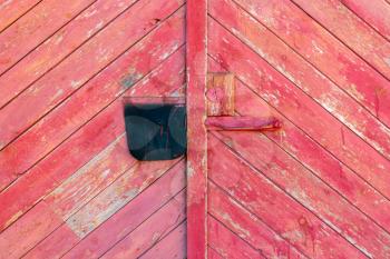 Old wooden door (gate) of the barn or garage. Can be used as the background or texture for photo editors