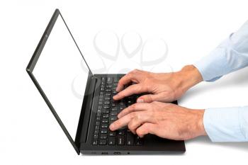 Closeup of the hands are using laptop keyboard with blank white screen.