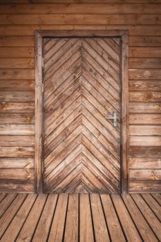 Close up of closed wooden door of ecological wooden house