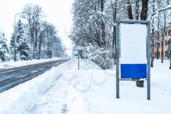 Old billboard for advertising on the street after heavy snowfall