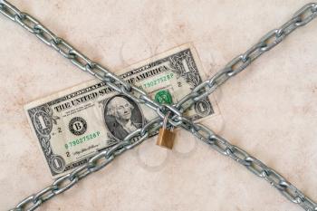 Dollar with chain and padlock.Financial safety, economic crisis, business investment, currency and money protection concept.