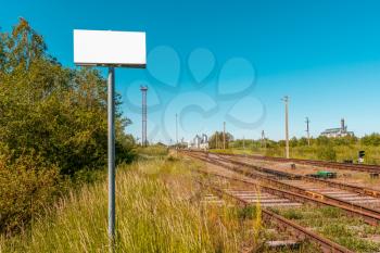 Blank banner in front of empty railroad 
