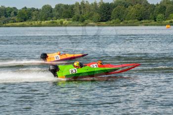 Formula boats go fast along the lake in Powerboat competition