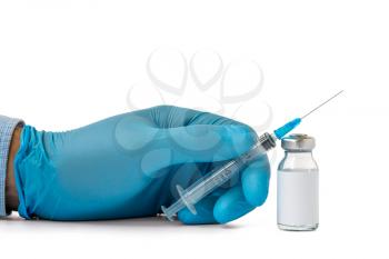 Hand holding syringe and medicine vial prepare for injection. Copy-space.