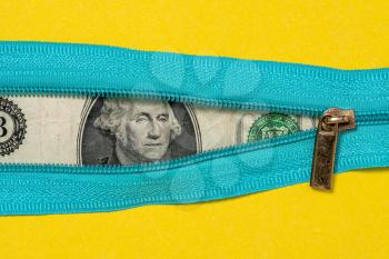 One Dollar Bill With Zipper on Yellow Background. Financial concept.