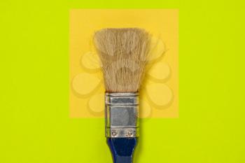 Creative concept made with paint brush and colorful  background. Minimal flat lay.