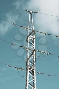 Electricity transmission power lines with blue sky (High voltage tower)