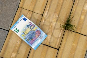 20 Euro banknote lying on the ground. Lost money.