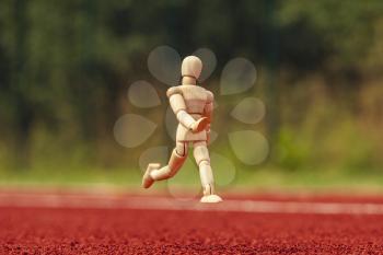 Dummy  running on the stadium track with rubber surface