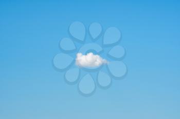 Lonely cumulus cloud.White fluffy cloud on blue sky background.