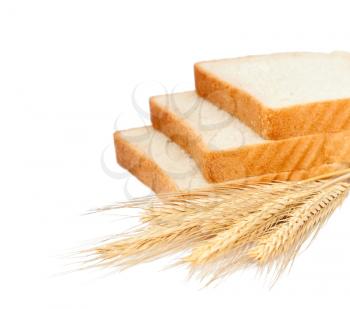 Wheat bread and grains and ears on white background