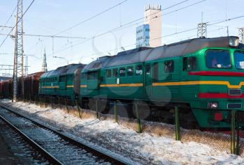 Diesel locomotive with cargo on winter station